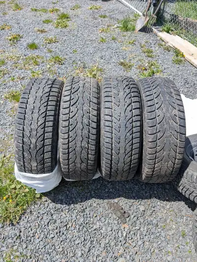 Very low kms winter tires Took them off for studded tires