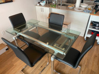 Glass and steel dining room table & four chairs