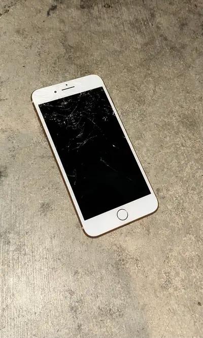 Selling an iPhone 8 Plus in Gold/White. Please note that the front screen is heavily cracked and sha...