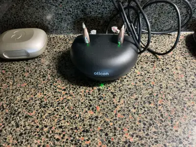 One set of like new Oticon hearing aids. Serviced twice a year, Comes with - original receipt ($5000...