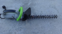 CUT YOUR WORK SHORT WITH AN 18 INCH  EARTHWISE HEDGE TRIMMER