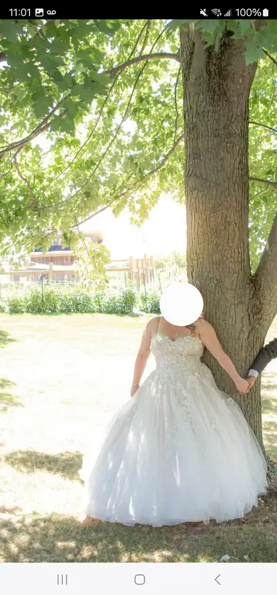 A wedding dress that will hold your girls in like no other. Fits amazing, and has a corset back, wit...
