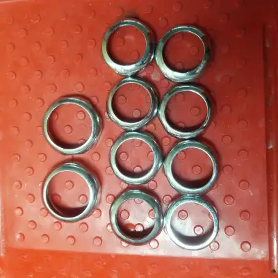 Here we have an assortment of faucet rings and washers, perfect for plumbing repairs or DIY projects...