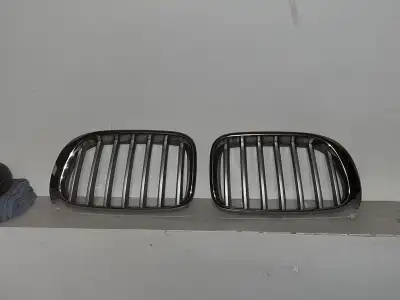 Enhance your BMW's appearance with this used front grill, designed to fit various BMW models. X3 and...