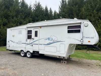 03 cougar by keystone had water leak needs a repair and a good cleaning need fridge repair selling a...