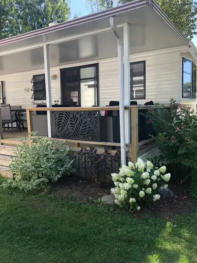 Recently updated park model situated on the second best lot next to water front is a 1998 Travelaire...