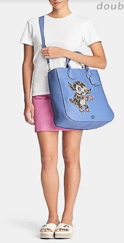 Check out this absolutely cute Coach handbag, illustrated by Gary Baseman! This soft but tough thick...
