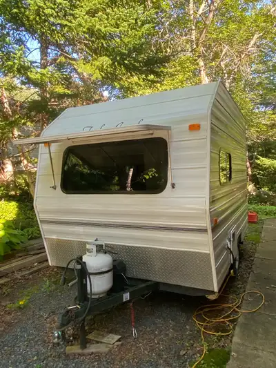 12’6” long, 1000 lbs, Interior height 6’4” 2 burner cook top, microwave, refrigerator AC and 12volt...