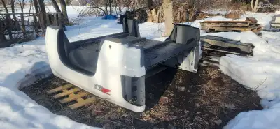 This is a used, but functional, GMC Sierra truck bed, ready to be installed and get back to work. It...