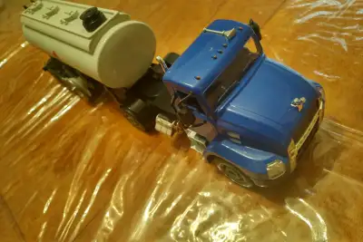 Tested and working. Comes with remote control, charger & battery. RC water tank trailer & RC truck....