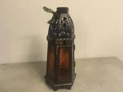 This candleholder shows wonderfully for its age, the door has a latch on it that when you open it sh...