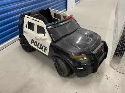 I am selling two kids ride on cars. One is a black Mini Cooper and the other is a black and white po...