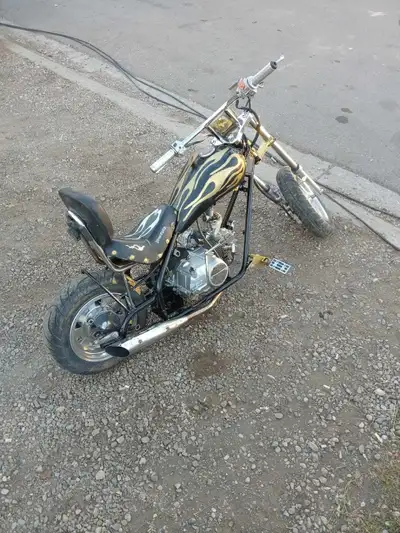 Custom painted mini chopper runs like new. One of a kind painted flames that glow in the dark. Needs...