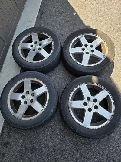 4 Alloy wheels for sale. Tires might last a season but are pretty much shot. Rims are not bent or da...