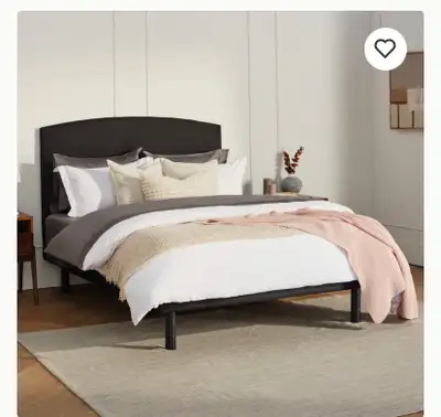 Black upholstered headboard and frame. Includes 6 supporting legs and very good condition