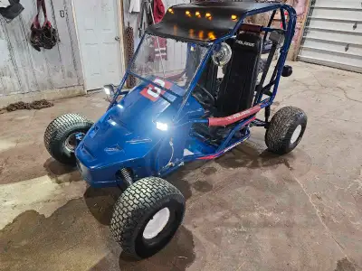 400 cc dune buggy, sand rail, go cart. Tops out mid 60s kmh with an adult. Double seater for double...