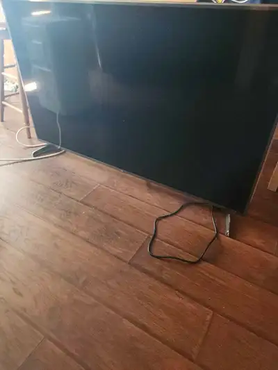 Free 55 inch.L.G. T.V works good....3 white circles on right side of screen...missing led lights...w...