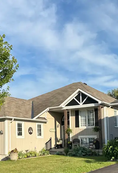 This premium raised bungalow is situated on an oversized 51ft x 244ft lot featuring beautiful perenn...