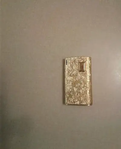 Vintage Ronson Gold plated 15V Wedge shaped Lighter - Made in France Size Approx.: 2.5" Tall x 1 3/8...