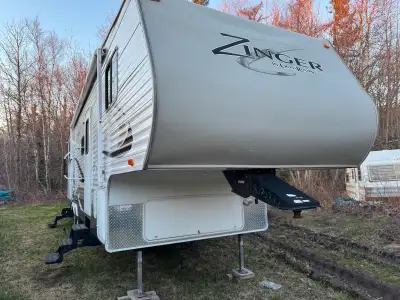 Selling for my grand father, a 2013 Zinger 5th wheel camper trailer. It’s barely been used and has s...