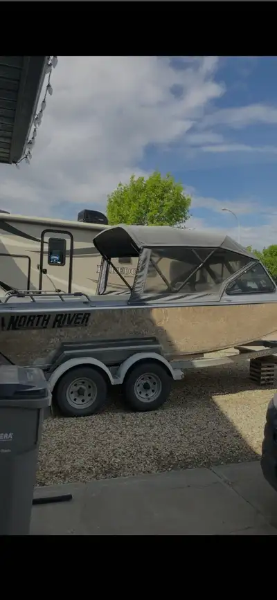 2002 North River Trapper 20' jet boat with 320 Hours. Has full canvas top, drop curtain and sloper t...