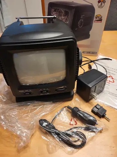 Curtis 5.5" black & white portable TV, with AM/FM radio. Excellent condition. Never used. In origina...