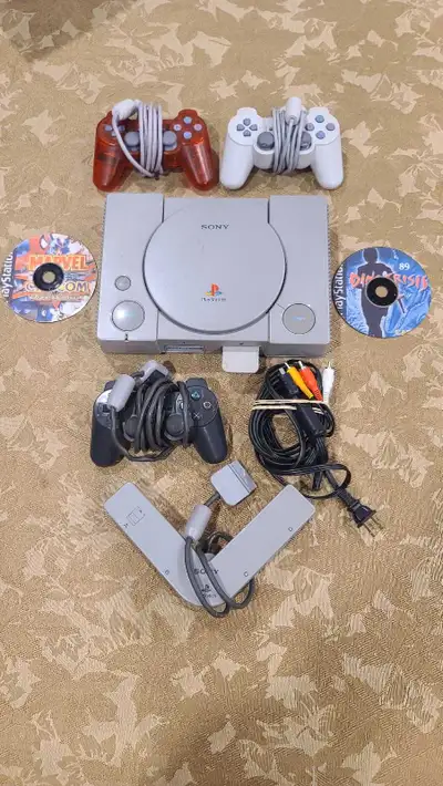 Modded Playstation 1 with 3 controllers multitap and memory card as well as 2 games marvel vs Capcom...