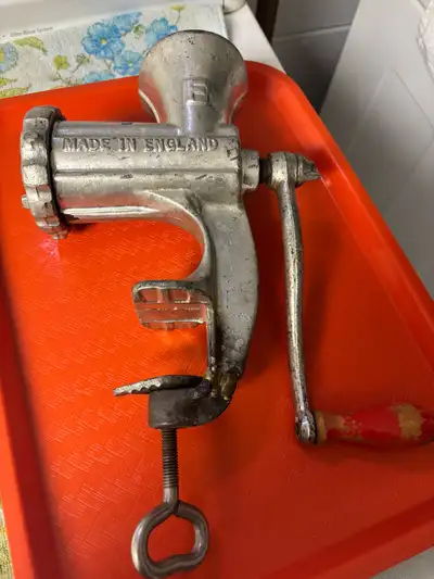 This is a used meat grinder with a clamp to secure to the counter for easy grinding. It is a vintage...