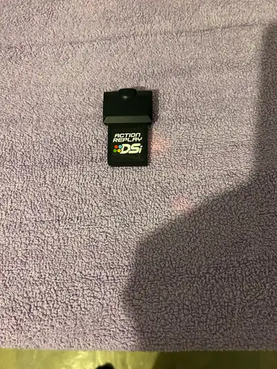 No USB cable included. Works on all original DS models. Asking $50.