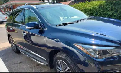 Get ready to elevate your driving experience with this eye-catching blue 2019 Infinity QX60, a spaci...