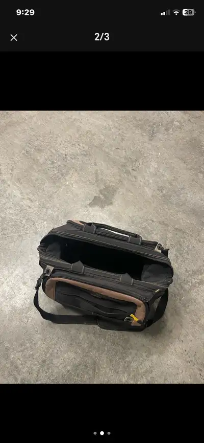 Organize your gear with this durable, pre-loved Kunys technician tool bag, perfect for securely tran...