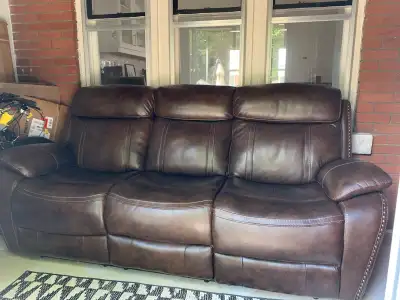 Brown leather reclining sofa, View more