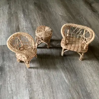 Wicker furniture for barbie size dolls. One set includes a chair , a love seat and a little patio ta...