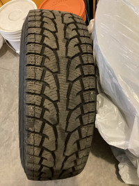 Four snow tires and rims for a Ford Ranger