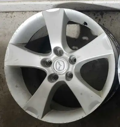 4 Mazda Mags 125$: Bolt pattern 5x114.3mm, 3 mags in good condition with some scratches, 4th mag has...