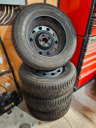 Set of 4 Firestone Winterforce 2UV winter tires with rims, only used for one season! Lots of tread l...