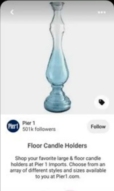 This Pier 1 Imports glass floor candle holder stands tall at approximately 3 feet, creating an elega...