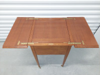 Antique prohibition era pop-up liquor table