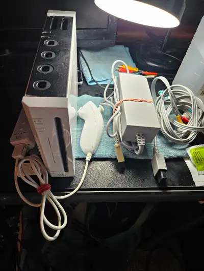 Selling a used Nintendo Wii bundle with MarioKart Wii. Includes: Wii-Mote Nun-Chuk Wii Sensor Bar Co...