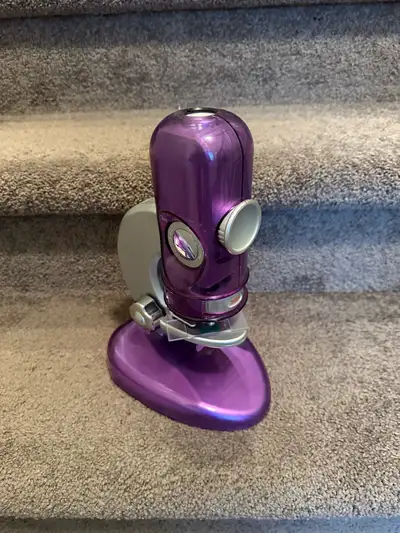 Explore the microscopic world with this used Scientific Toys My First Lab iridescent purple microsco...