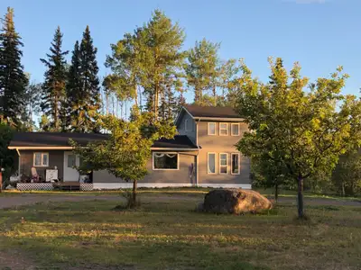1280 sq foot 1 and 1/2 storey home nestled within trees on a quiet 5.28 acre property at the end of...