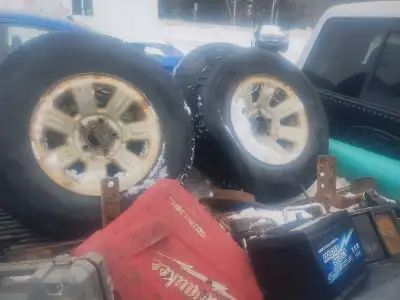 4-235/75/15 tires on Ford Ranger rims with centres 2 tires like new 2 half worn 220