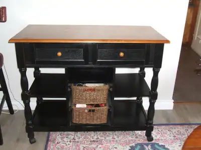Large kitchen island on wheels,in used good condition.measurements are 47 inches long by 24 in. wide...