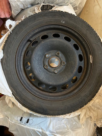 Goodyear ultragrip winter tires on rims. 