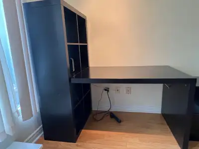 Office desk with attached shelving unit and office chair, View more