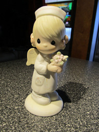 " Angel Of Mercy"  Precious Moments figurine.