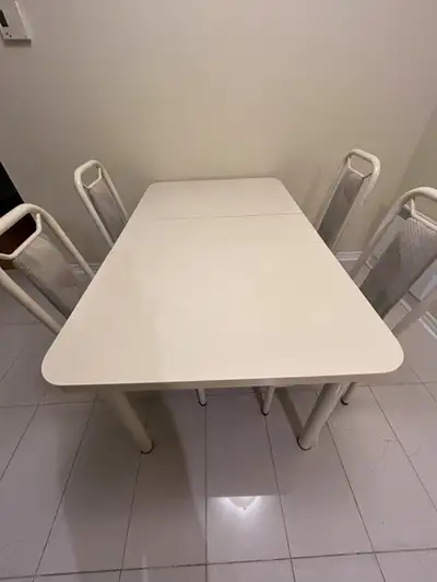 This is a set of Five (5) Table plus 4 Chairs Table - 5Ft x 3 Ft wide with an extension middle piece...