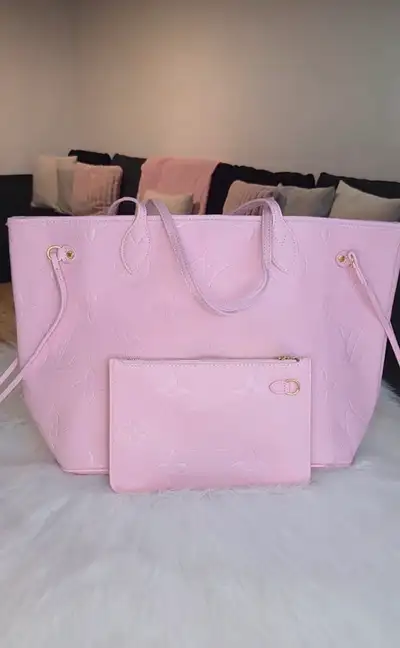 Brand new Louis Vuitton Neverfull MM in the pink pattern, a stylish and practical tote bag. The bag...
