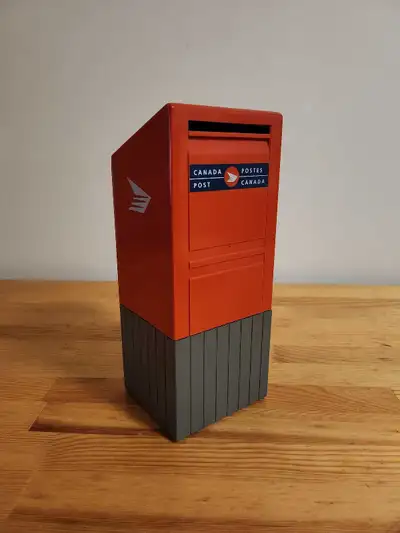 This object is a vintage Canada Post mailbox piggy bank, a popular collectible replica of the iconic...