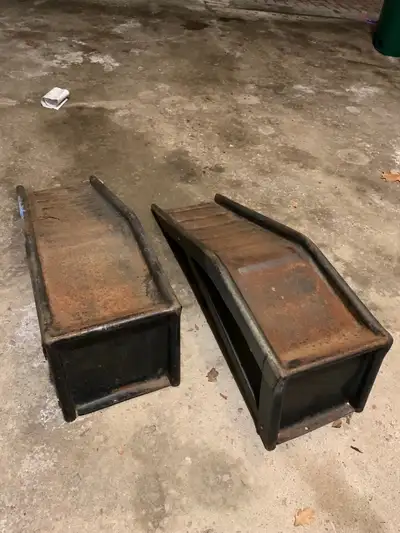These are a pair of used heavy-duty metal truck ramps, perfect for maintenance or repairs. (We paint...